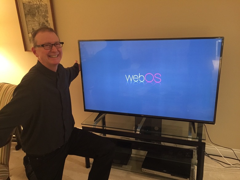 Jay admiring his new 55 TV birthday gift