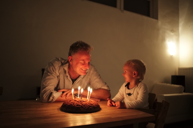 Constantin blowing out dads birthday candles